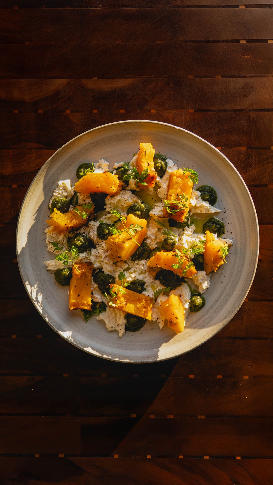 ROASTED BANANA SQUASH WITH TOASTED SEED PESTO AND BURRATA